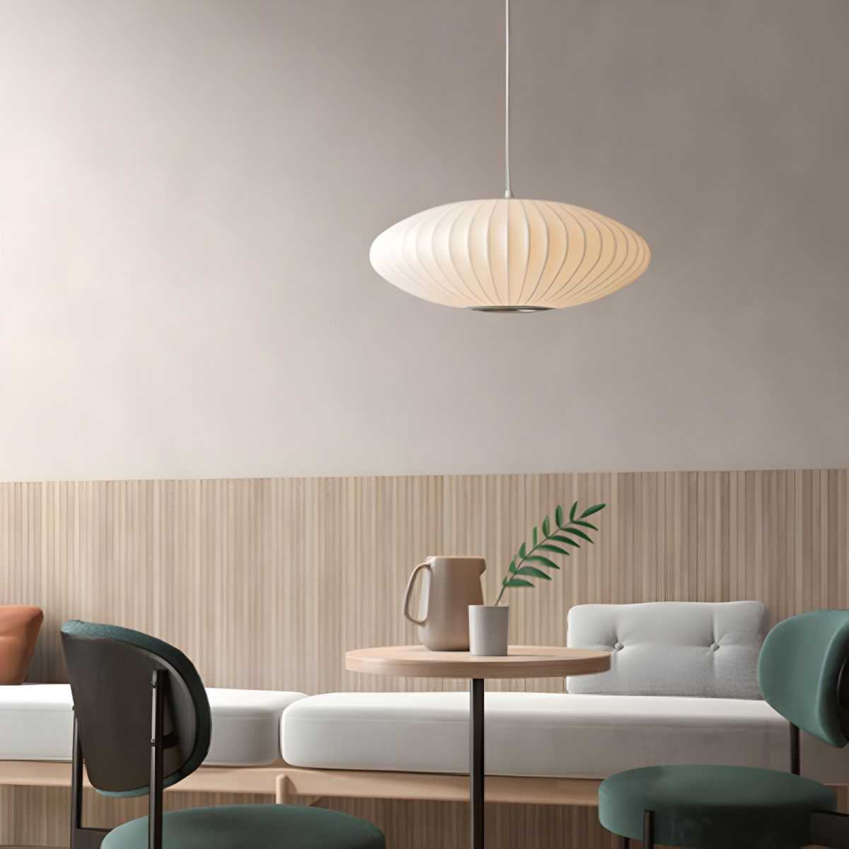 Minimalist indoor disk-shaped silk pendant lighting in modern living space.