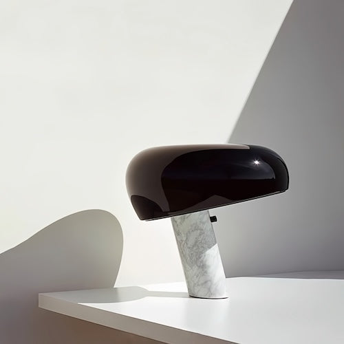 Stylish post-modern marble desk lamp in black and white with sleek design, shown on a minimalist white surface.