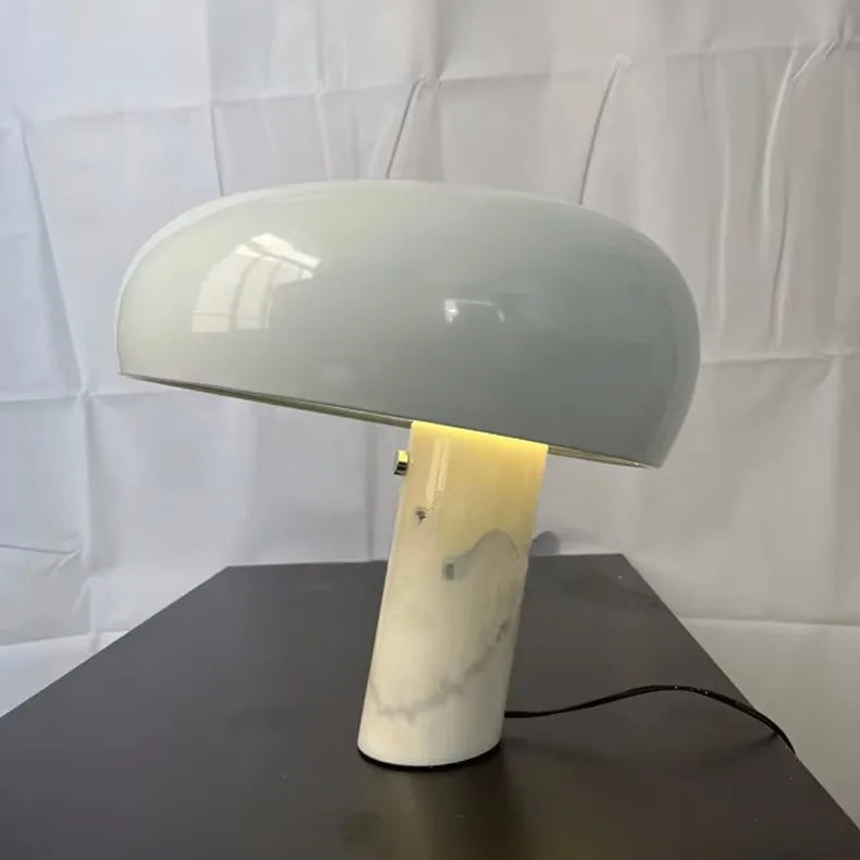 Post-modern marble desk lamp with a white, curved shade on a marble base, ideal for stylish workspaces.