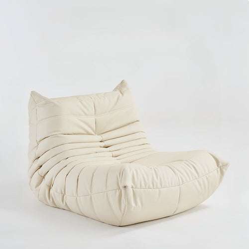 Togo Chair in creamy suede, minimalist modern lounge chair for living room comfort.