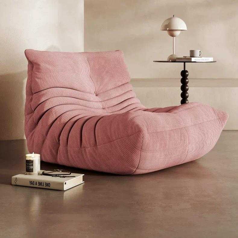 Cozy Togo Chair in soft corduroy for stylish living room.