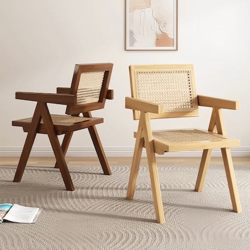 Elegant rattan chairs with natural wood frame and hand-woven design for ultimate relaxation.