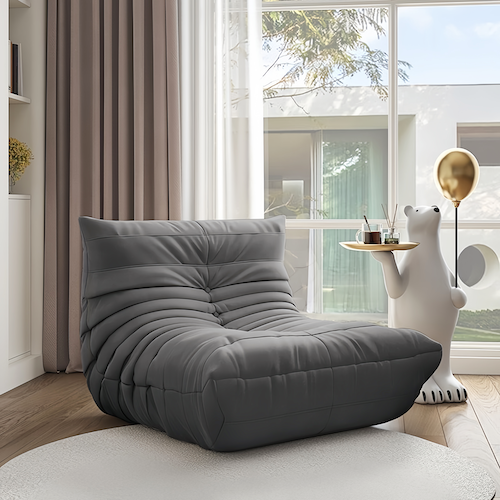 Togo Chair in a modern living room, featuring plush design with premium upholstery for ultimate comfort.