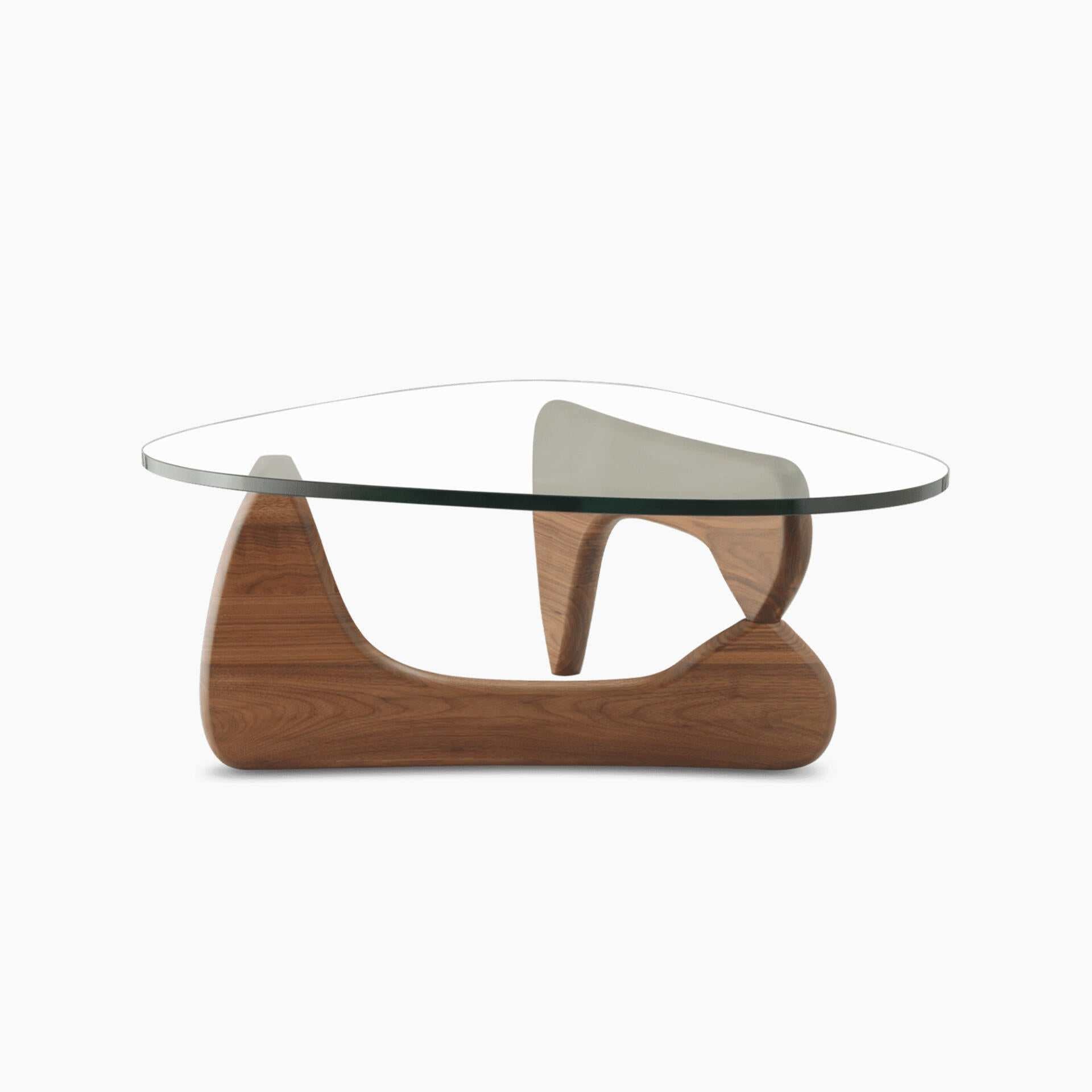 Noguchi Coffee Table with sculptural wooden base and freeform glass top.