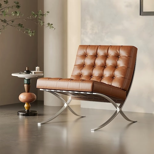 Premium black and brown leather Barcelona chair with stainless steel frame, modern luxury seating.