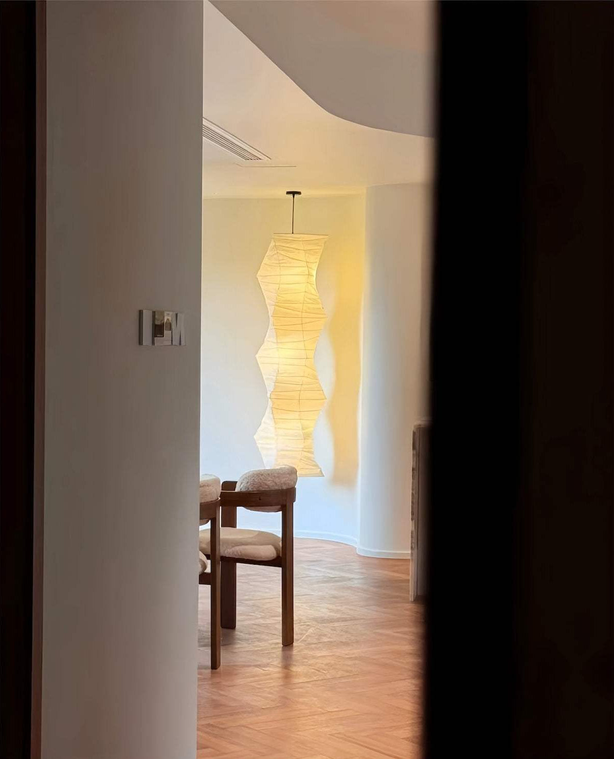 Modern interior with a unique rice paper pendant light fixture - orangme.com