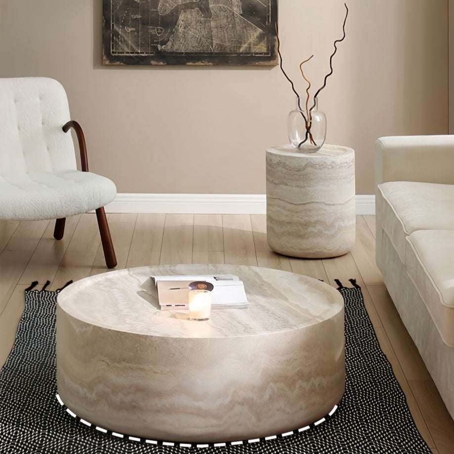 Round marble coffee table in a stylish living room setting - orangme.com