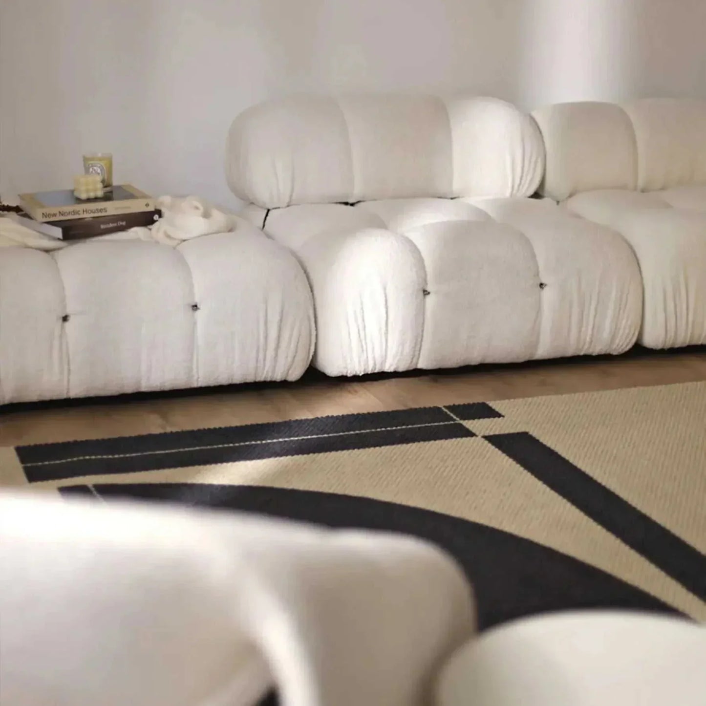 Modern sectional sofa with flexible fabric modules in a living room setting.