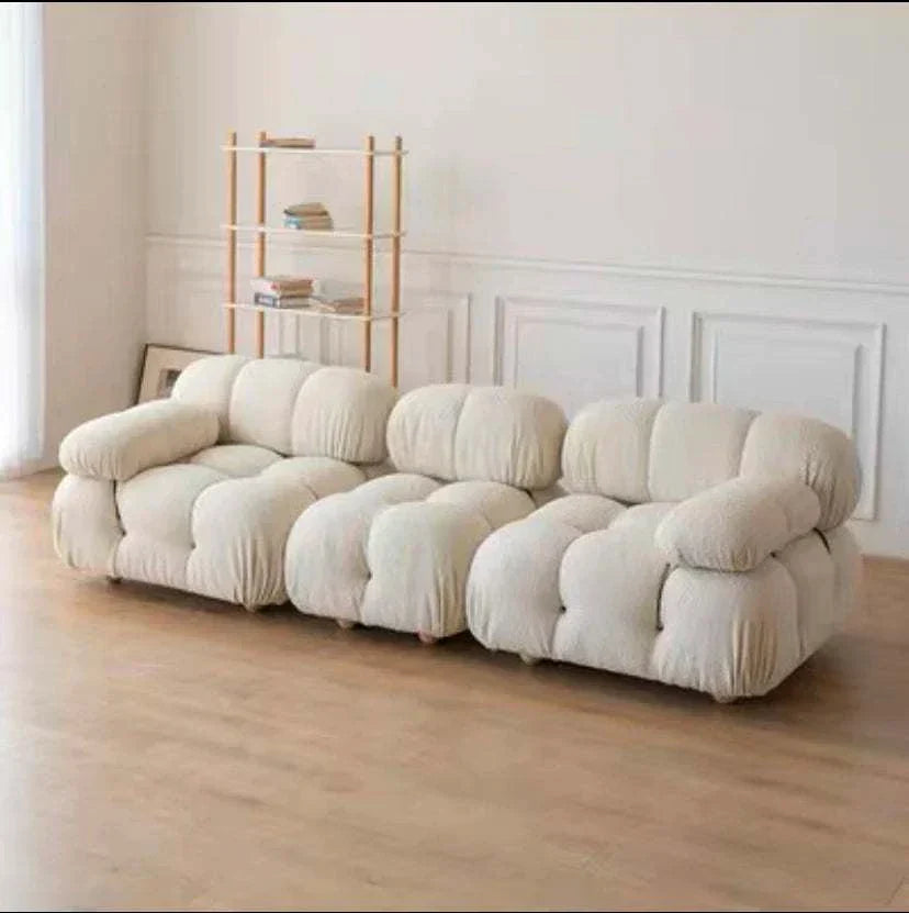 Modern sectional sofa with flexible fabric modules in a cozy living room setting.