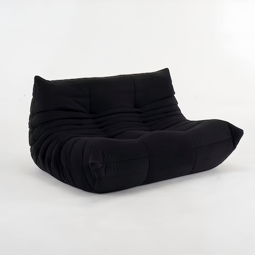 Chic Togo 2-Seater Sofa in black suede in a modern living room setting - orangme.com