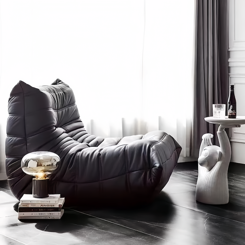 Luxurious Togo Chair Dupe in fiber leather upholstery, modern interior setting.